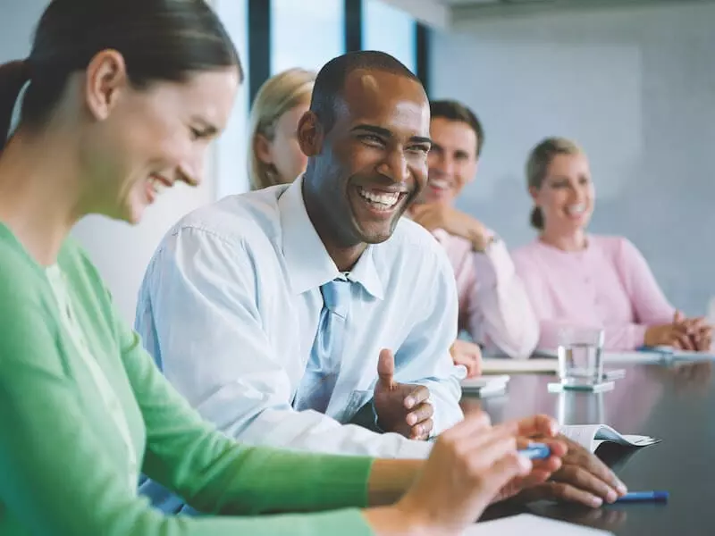 Business People Laughing During Meeting